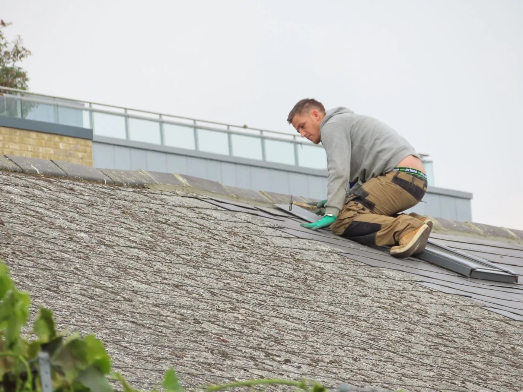 Roofer working on a residential roof